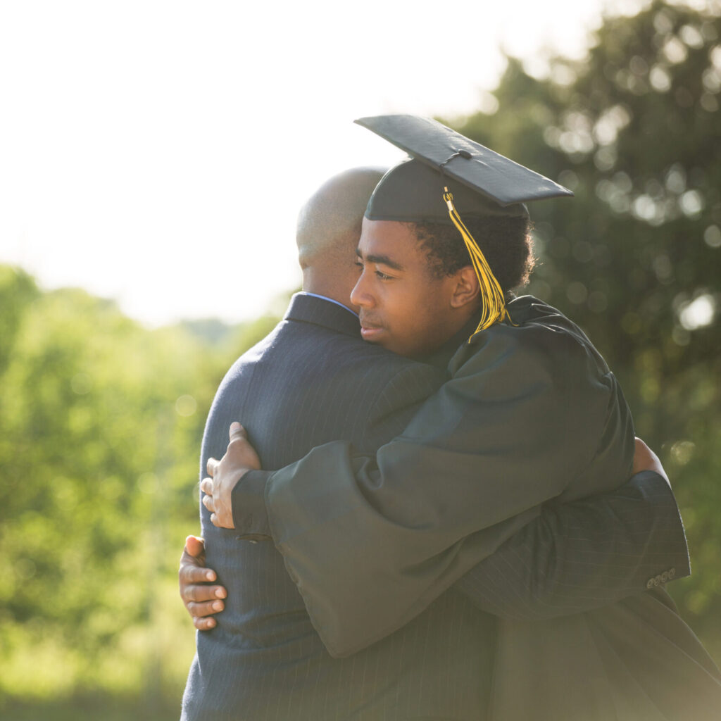African,American,Student,Celebrating,Graduation,With,His,Dad.